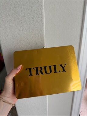 TRULY Metallic Gold Logo Tin Clutch
